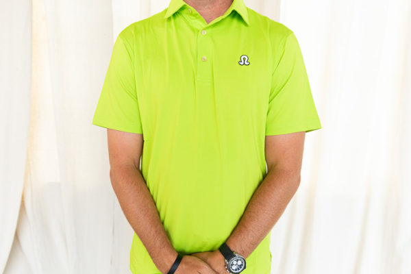 Male model wearing green polo