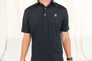 Front view of black polo with blue logo