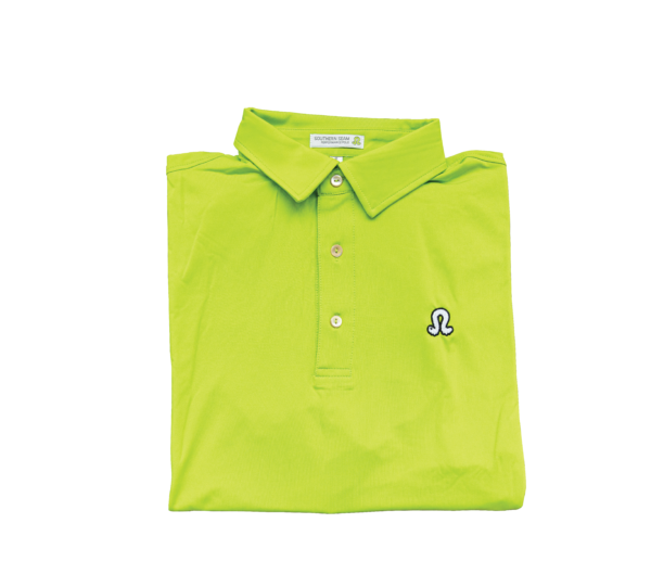 Green polo folded on a white background